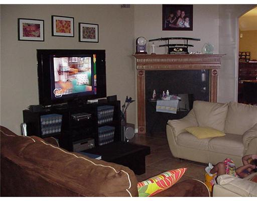 6850 Round Table Street Corpus Christi, TX 78414 - Photo 2 of 4 a living room with furniture and a flat screen tv