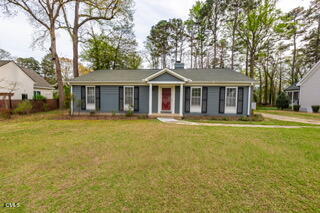 408 Ortega Road Raleigh, NC 27609 - Photo 2 of 25 a front view of a house with a yard and trees