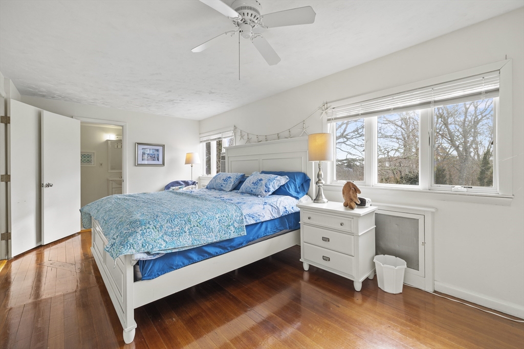 169 Gosnold Street Barnstable, MA 02601 - Photo 13 of 40 a bedroom with a bed and a large window