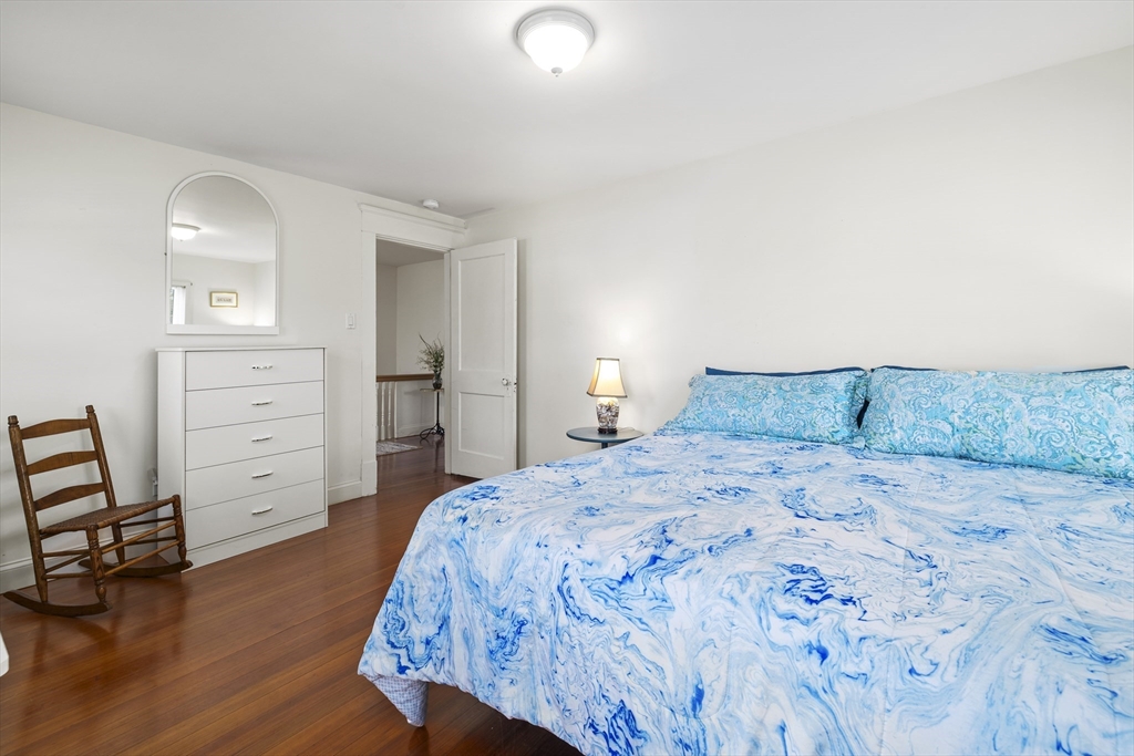 169 Gosnold Street Barnstable, MA 02601 - Photo 18 of 40 a bedroom with a bed and a cabinets