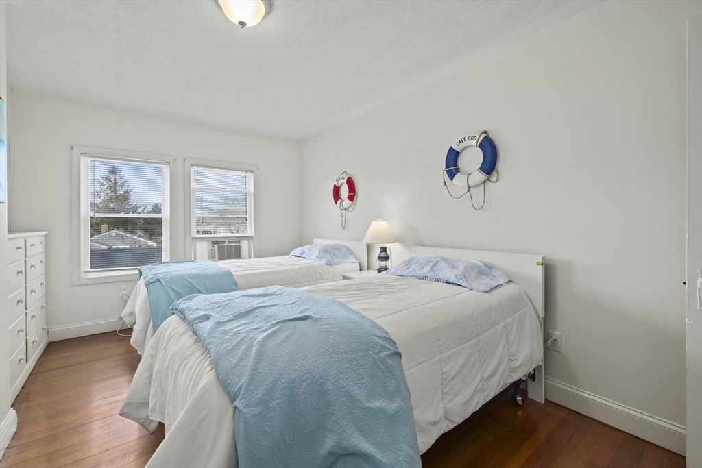 169 Gosnold Street Barnstable, MA 02601 - Photo 19 of 40 a bedroom with a bed and a window