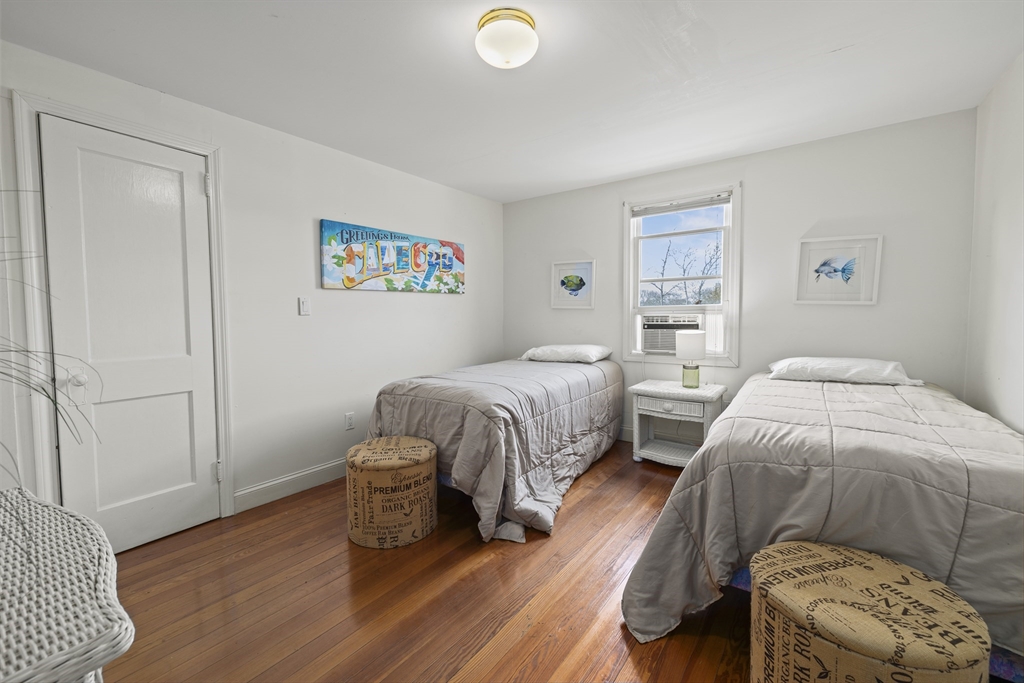 169 Gosnold Street Barnstable, MA 02601 - Photo 25 of 40 a bedroom with two beds and a lamp