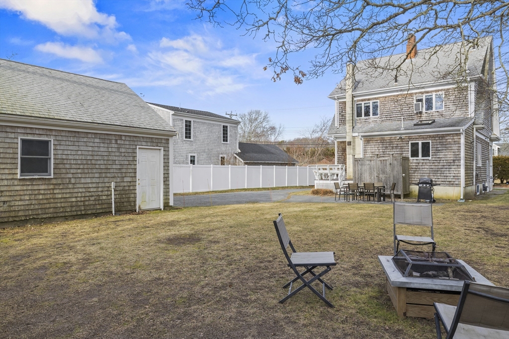 169 Gosnold Street Barnstable, MA 02601 - Photo 31 of 40 a view of a backyard with furniture