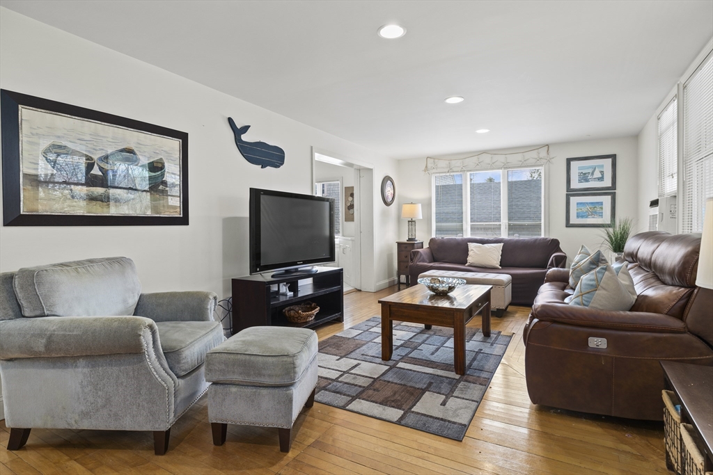 169 Gosnold Street Barnstable, MA 02601 - Photo 10 of 40 a living room with furniture and a flat screen tv