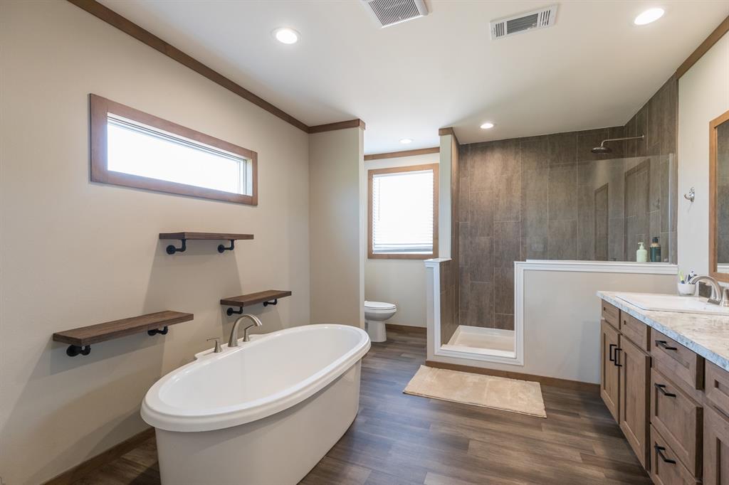 10099 County Road 452 Merkel, TX 79536 - Photo 14 of 28 a bathroom with a sink toilet and shower