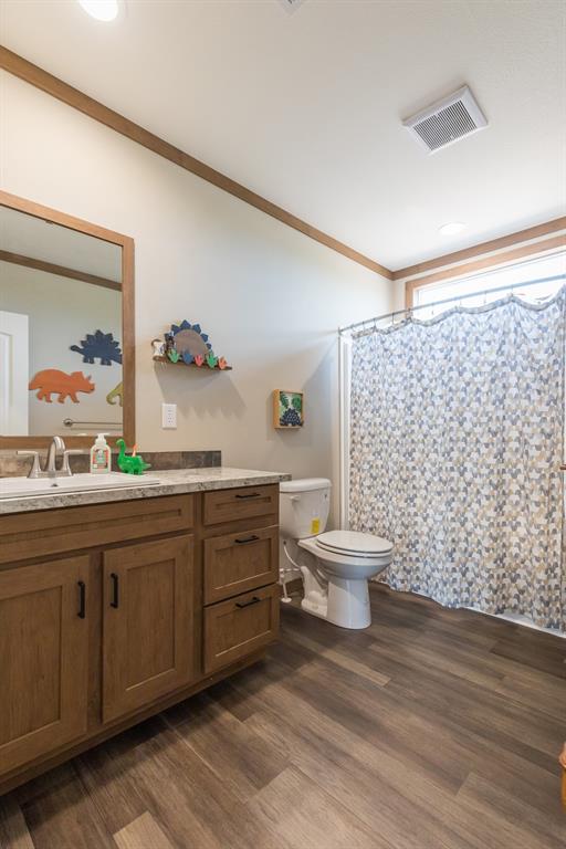 10099 County Road 452 Merkel, TX 79536 - Photo 21 of 28 a bathroom with a double vanity sink toilet and a mirror