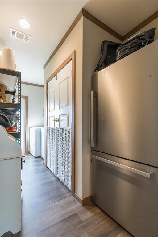 10099 County Road 452 Merkel, TX 79536 - Photo 25 of 28 a view of a refrigerator in kitchen and an empty room