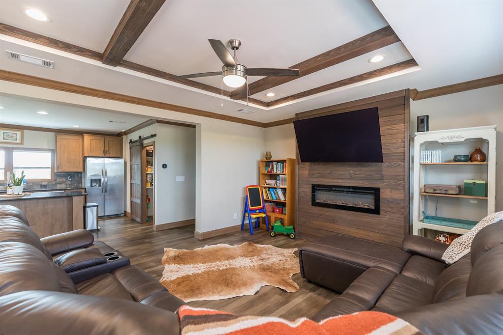 10099 County Road 452 Merkel, TX 79536 - Photo 8 of 28 a living room with furniture and a flat screen tv
