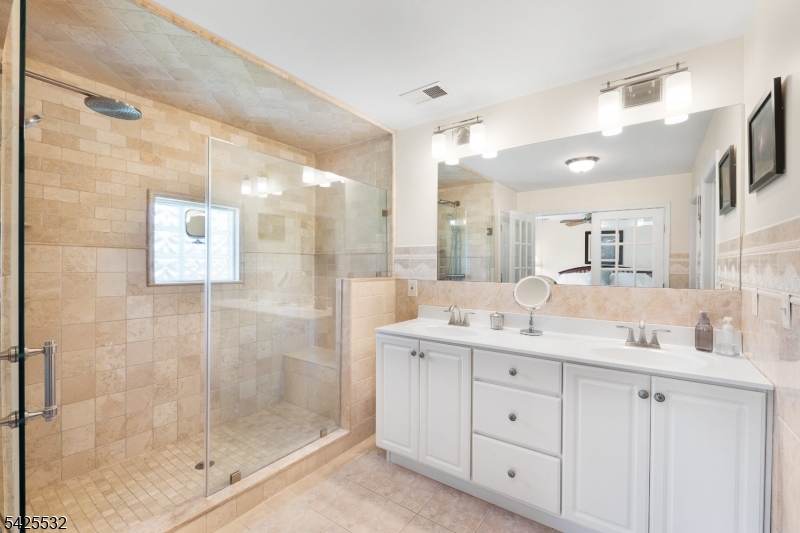 6 Ridge Road Frenchtown, NJ 08825 - Photo 21 of 33 a bathroom with a granite countertop sink mirror and shower