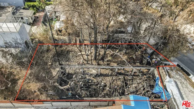 a street sign on a bunch of flowers