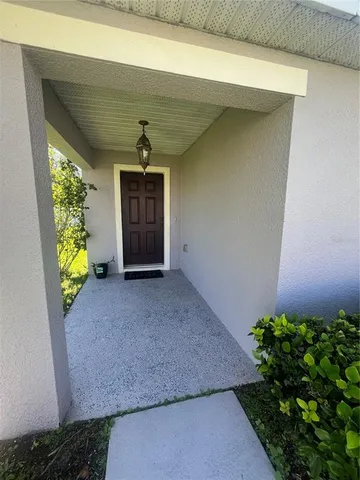 a front view of a house with a yard and a garage