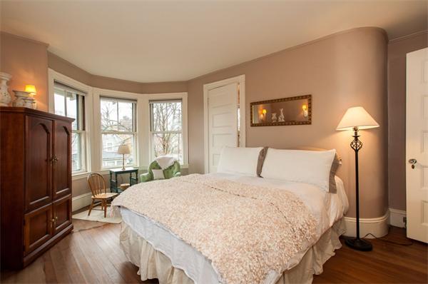 232 Edge Hill Road Milton, MA 02186 - Photo 17 of 23 a bedroom with a bed and wooden floor