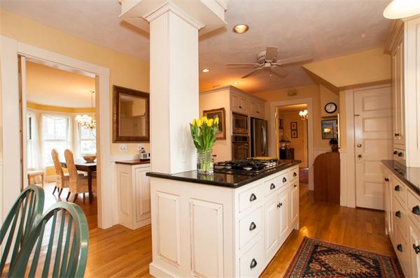232 Edge Hill Road Milton, MA 02186 - Photo 10 of 23 a kitchen with white cabinets and sink