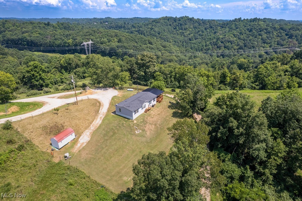 560 Wine Road Elizabeth, WV 26143 - Photo 44 of 50 Aerial view of property and surrounding area with a forest