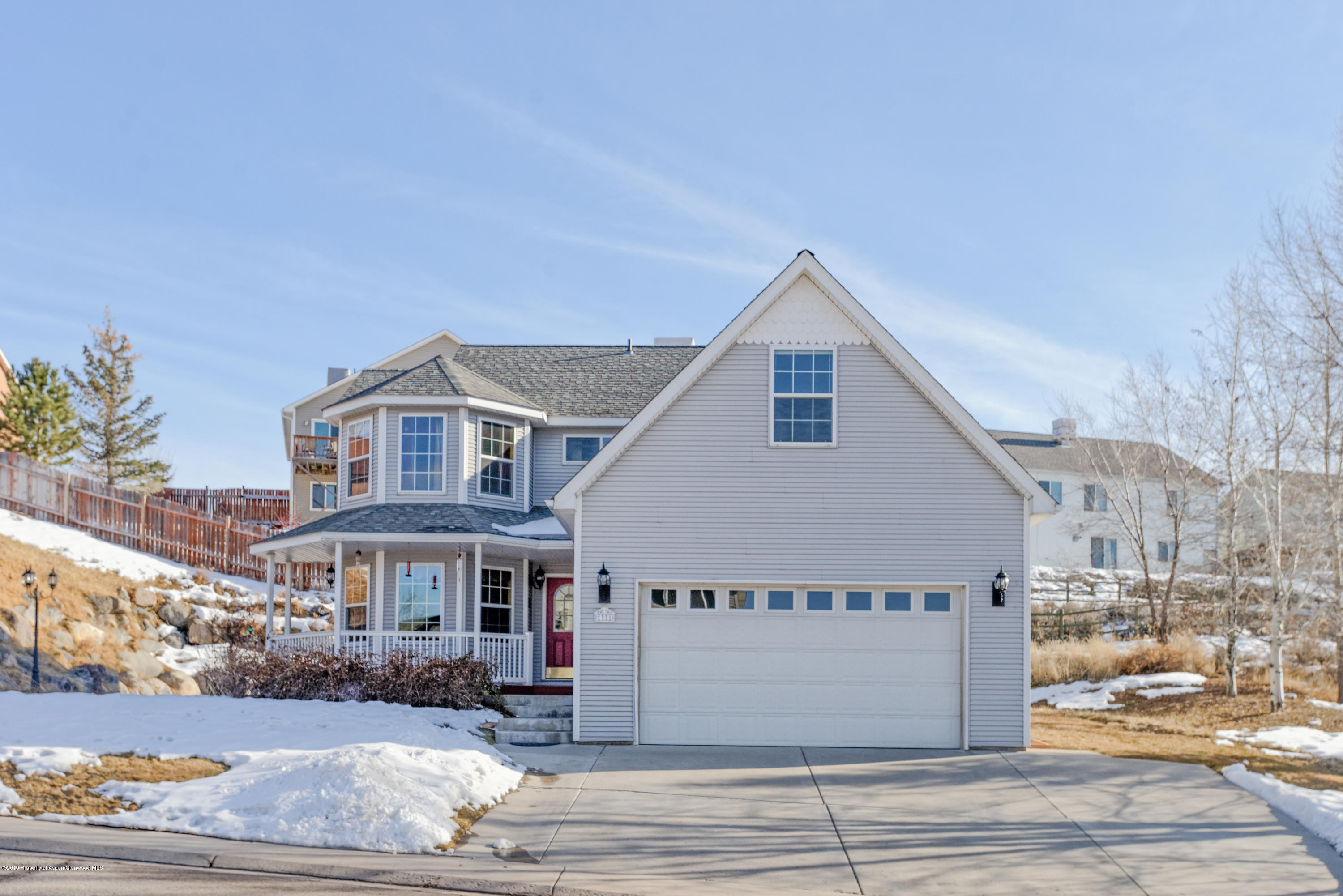 1371 Firethorn Drive Rifle, CO 81650 - Photo 1 of 16 a front view of a house with a yard