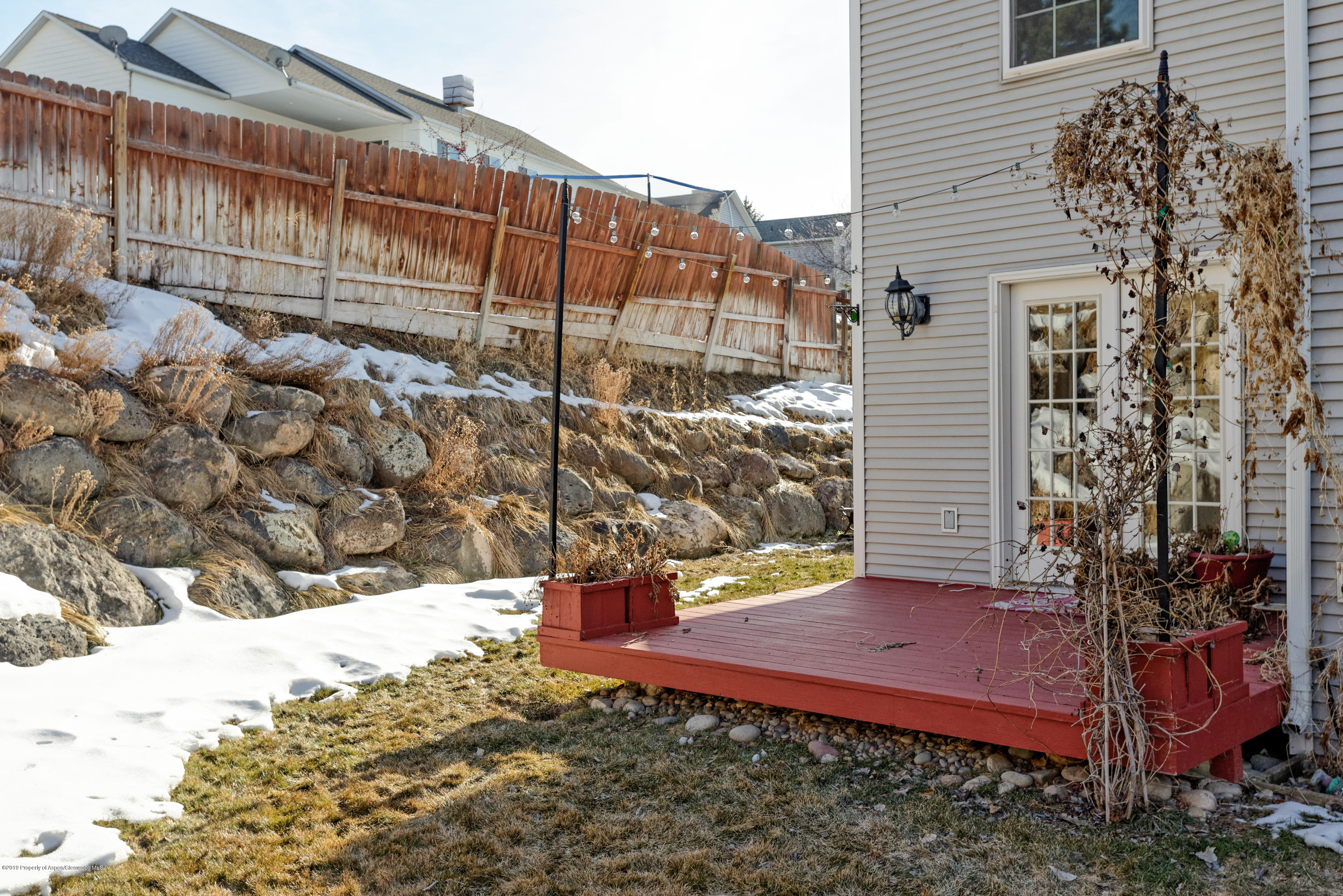 1371 Firethorn Drive Rifle, CO 81650 - Photo 15 of 16 a view of a yard with wooden fence