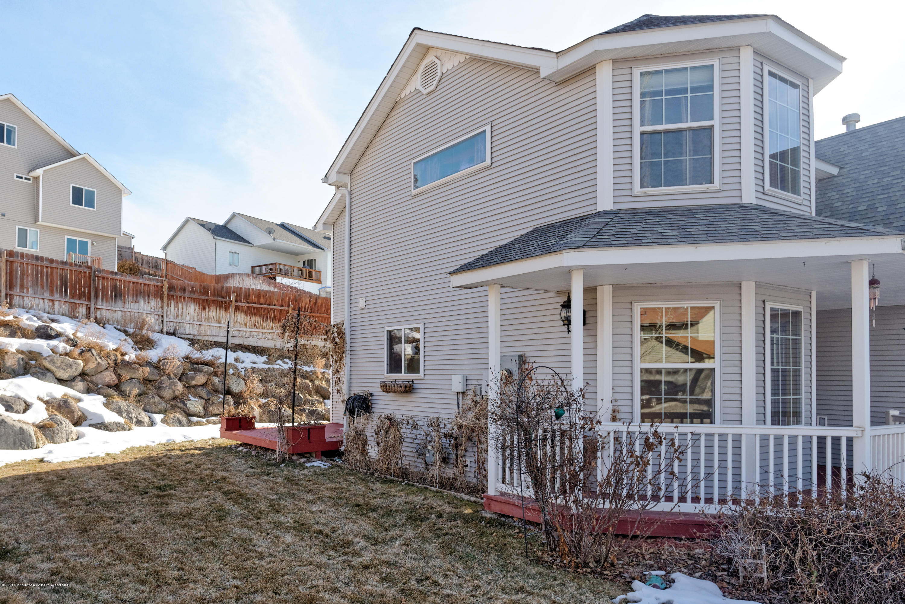 1371 Firethorn Drive Rifle, CO 81650 - Photo 2 of 16 a view of a house with a yard and balcony