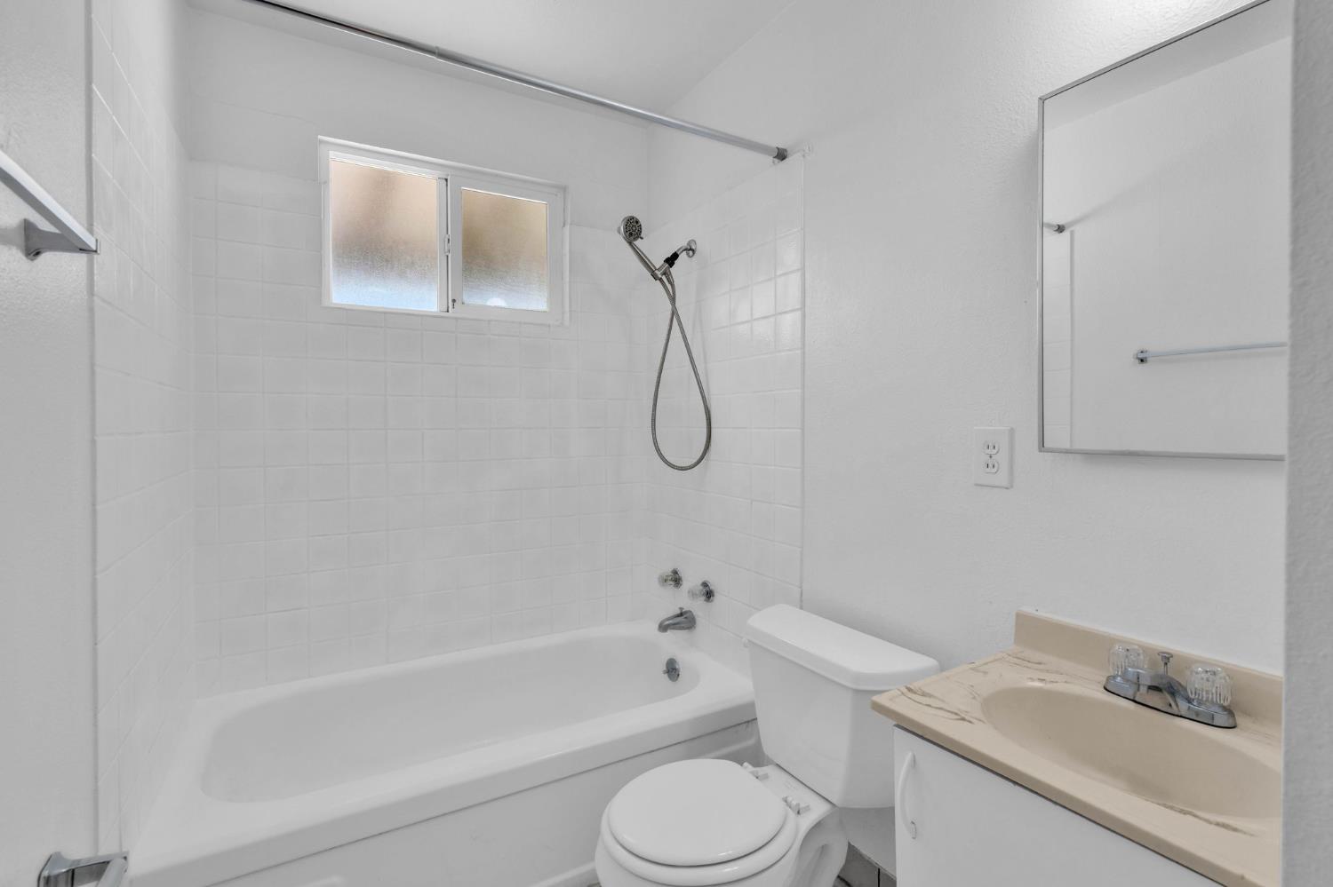 1714 Pole Line Road Davis, CA 95618 - Photo 12 of 24 a bathroom with a toilet sink and shower