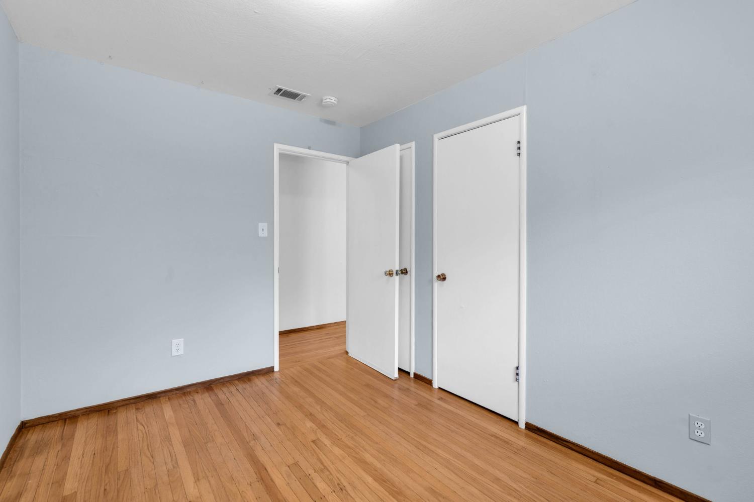 1714 Pole Line Road Davis, CA 95618 - Photo 14 of 24 a view of an empty room with wooden floor