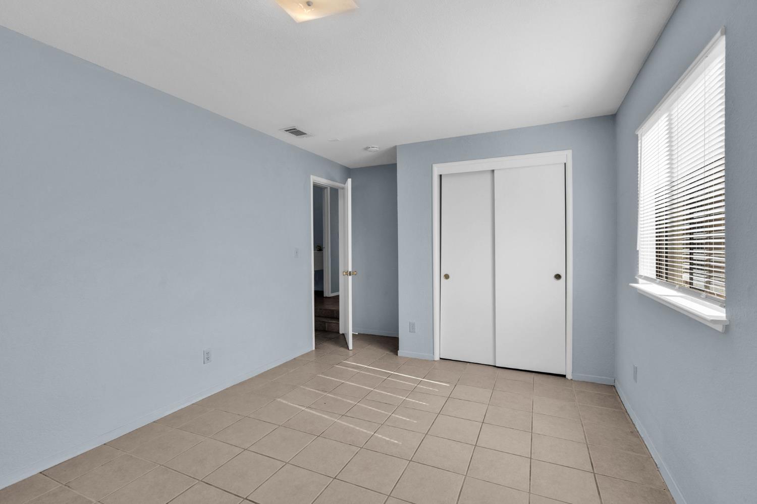 1714 Pole Line Road Davis, CA 95618 - Photo 17 of 24 a view of an empty room with a window