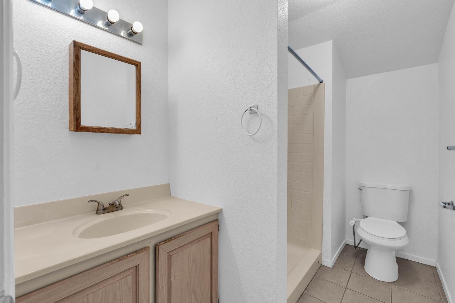 1714 Pole Line Road Davis, CA 95618 - Photo 20 of 24 a bathroom with a toilet sink and mirror