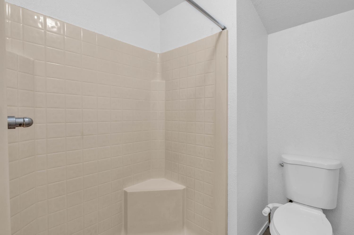 1714 Pole Line Road Davis, CA 95618 - Photo 21 of 24 a bathroom with a toilet and a shower