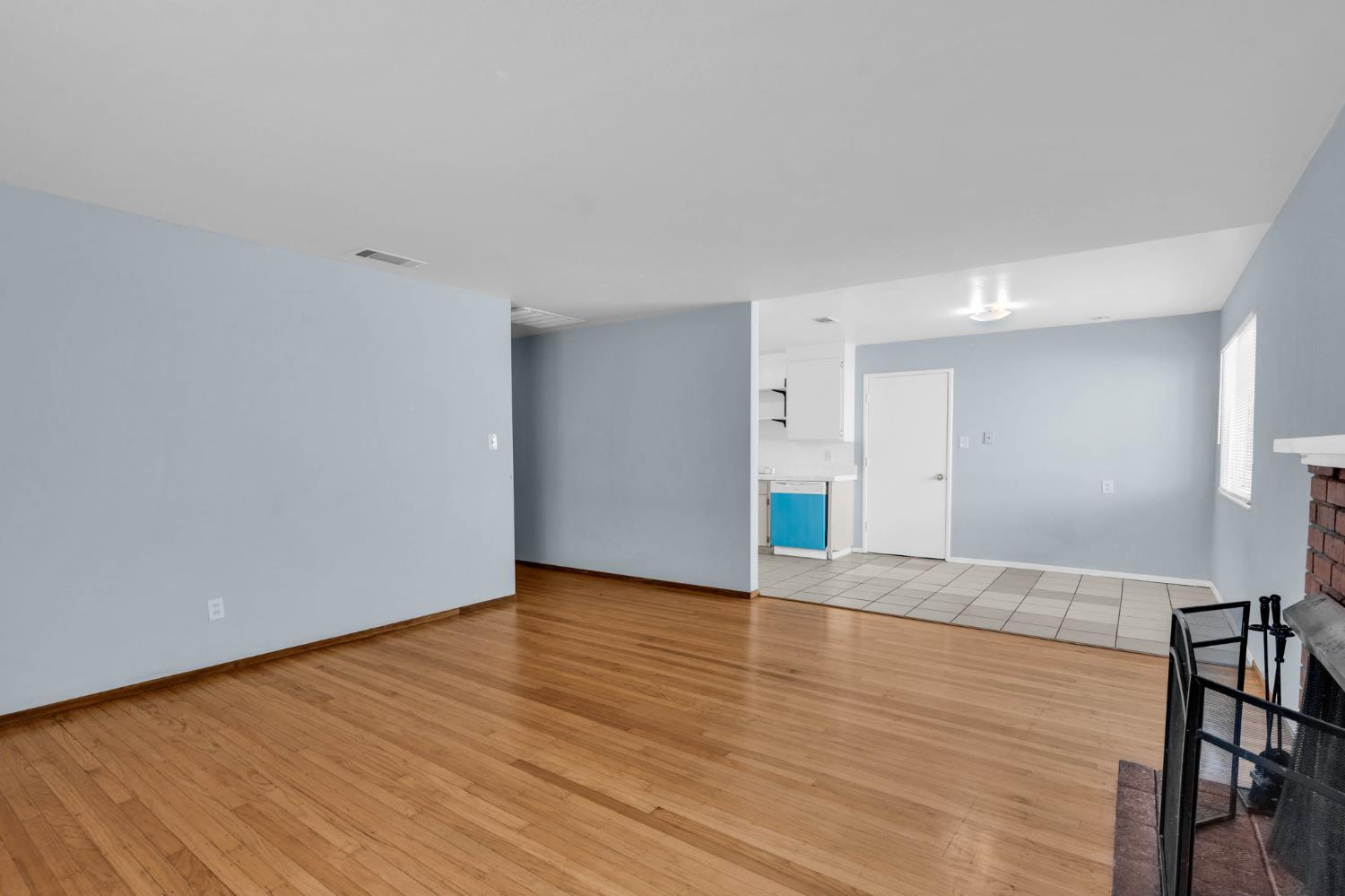 1714 Pole Line Road Davis, CA 95618 - Photo 5 of 24 a view of an empty room with wooden floor