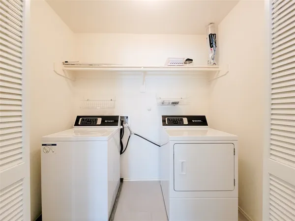 a utility room with dryer and washer