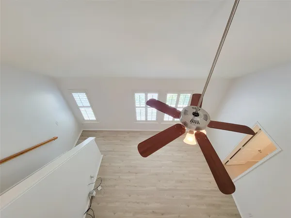 a view of staircase with white walls