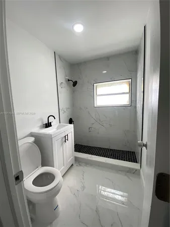 a bathroom with a toilet and a sink