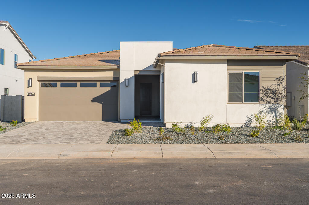 1946 East Empeltre Road San Tan Valley, AZ 85140 - Photo 1 of 19 a front view of a house with a yard