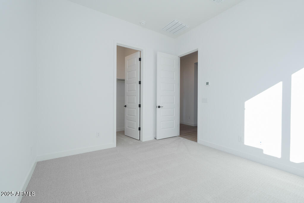 1946 East Empeltre Road San Tan Valley, AZ 85140 - Photo 12 of 19 a view of an empty room
