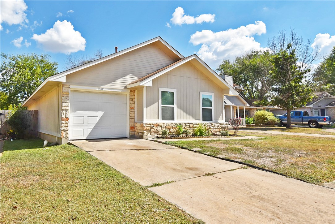 16813 Whitebrush Loop Austin, TX 78717 - Photo 1 of 22 a front view of a house with a yard and garage