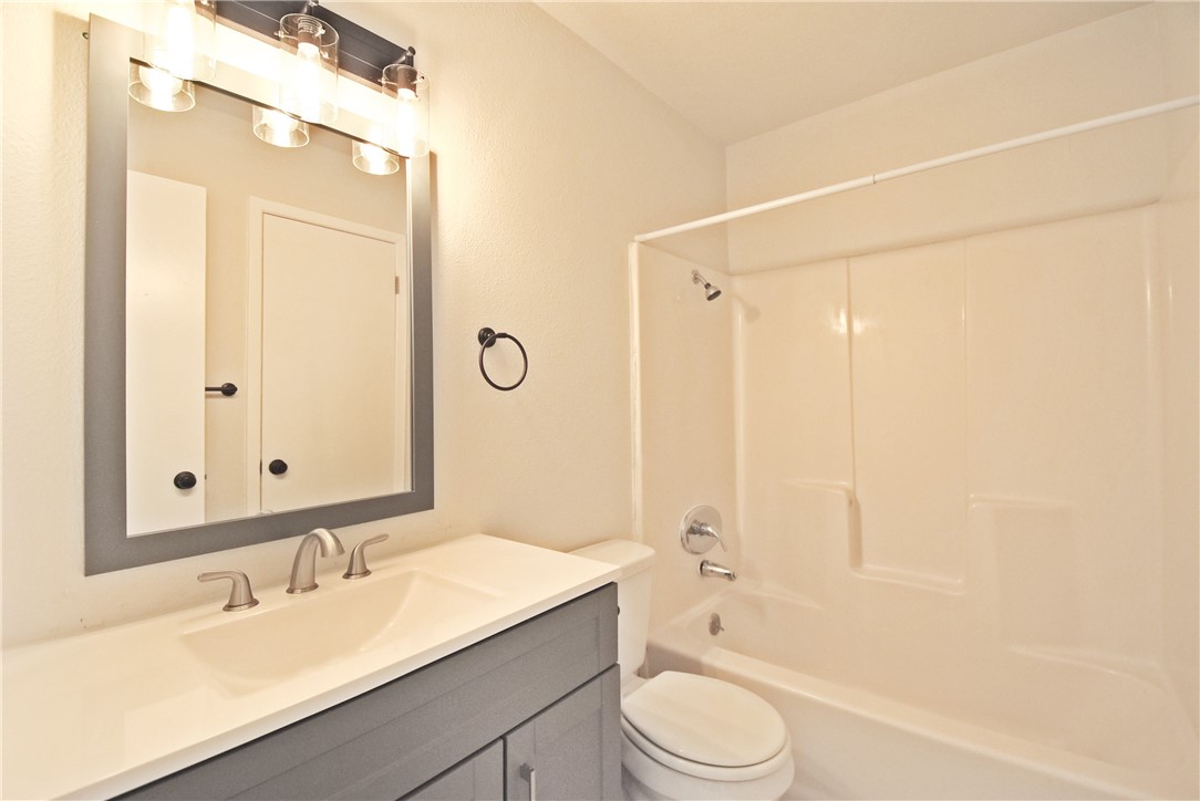 16813 Whitebrush Loop Austin, TX 78717 - Photo 9 of 22 a bathroom with a granite countertop sink toilet tub and shower