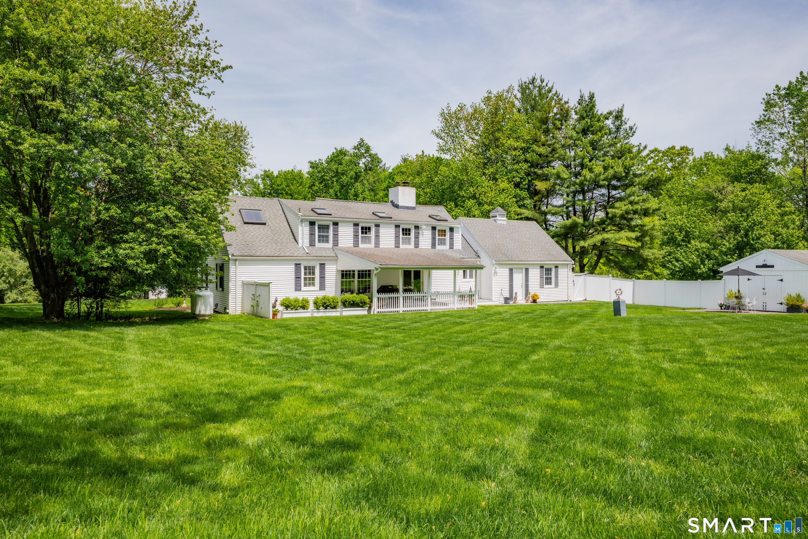 1000 Bassett Road Watertown, CT 06795 - Photo 31 of 35 a view of a house with a big yard potted plants and large tree