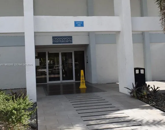 a swimming pool view with a outdoor seating