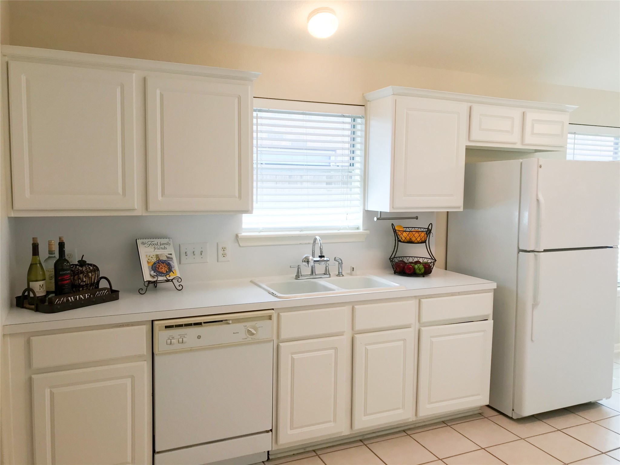 14615 Rochelle Court Cypress, TX 77429 - Photo 11 of 29 a kitchen with white cabinets and refrigerator