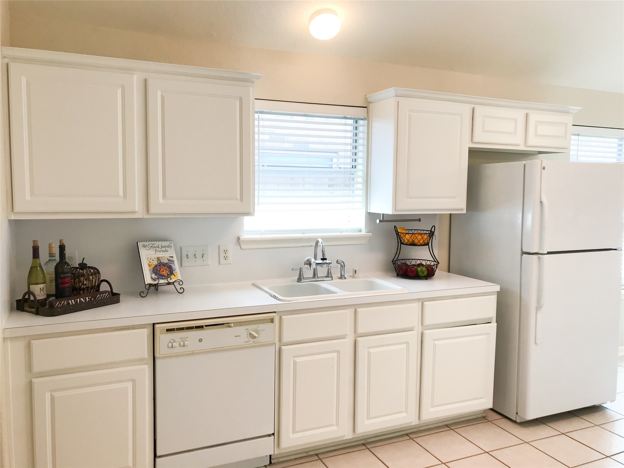 14615 Rochelle Court Cypress, TX 77429 - Photo 12 of 29 a kitchen with white cabinets and white appliances