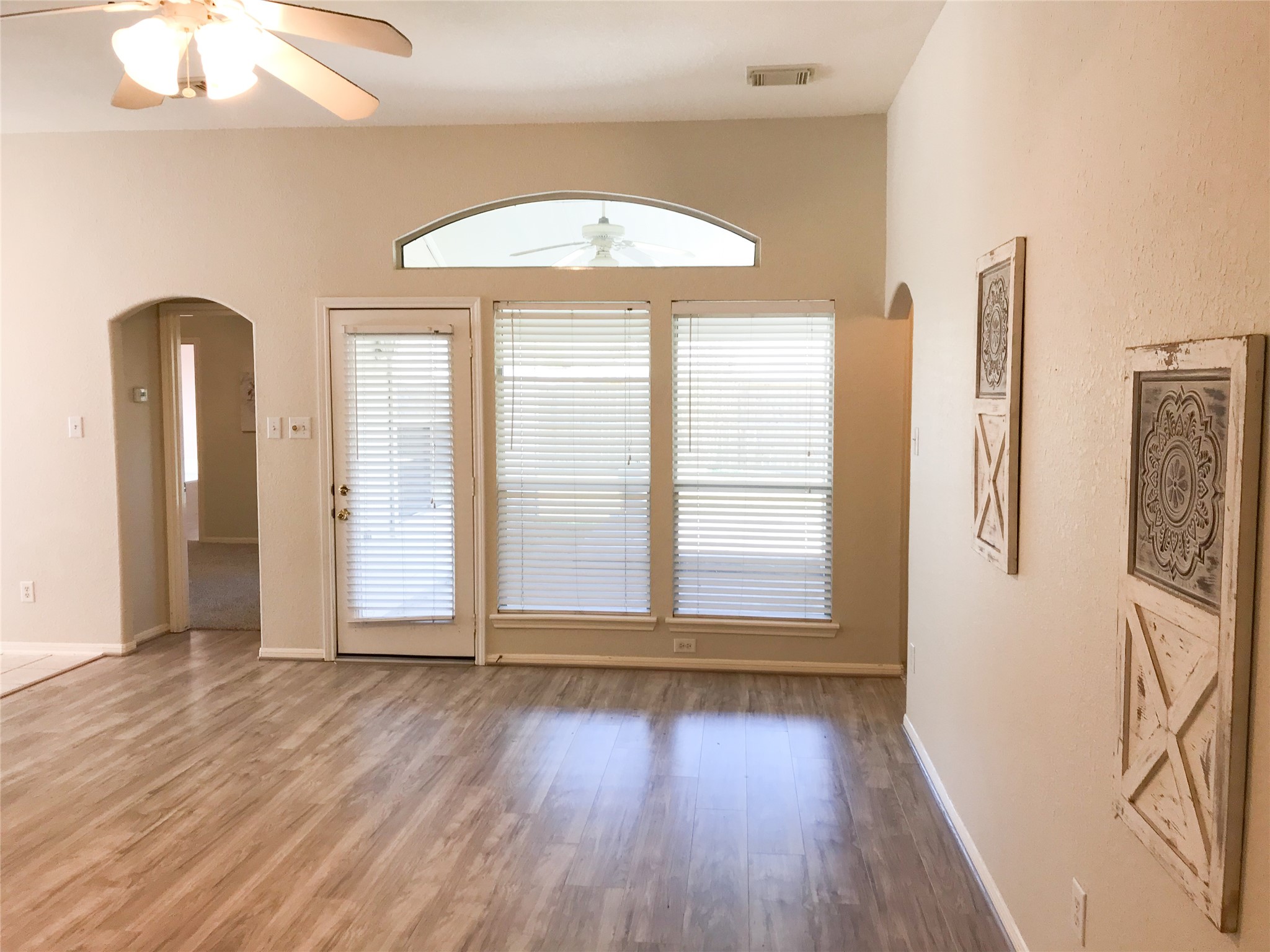 14615 Rochelle Court Cypress, TX 77429 - Photo 15 of 29 an empty room with wooden floor and windows