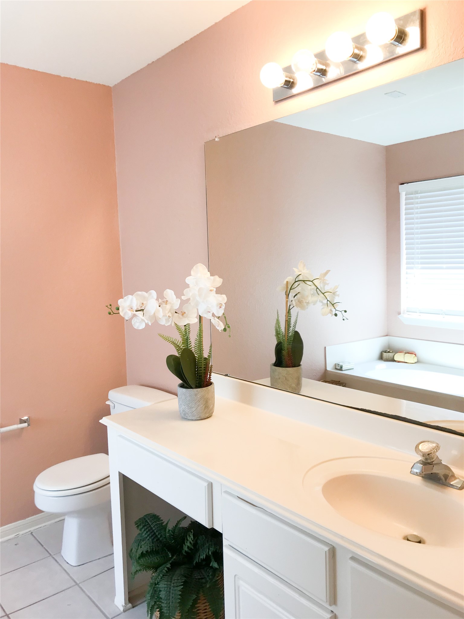 14615 Rochelle Court Cypress, TX 77429 - Photo 18 of 29 a bathroom with a sink a toilet and a mirror