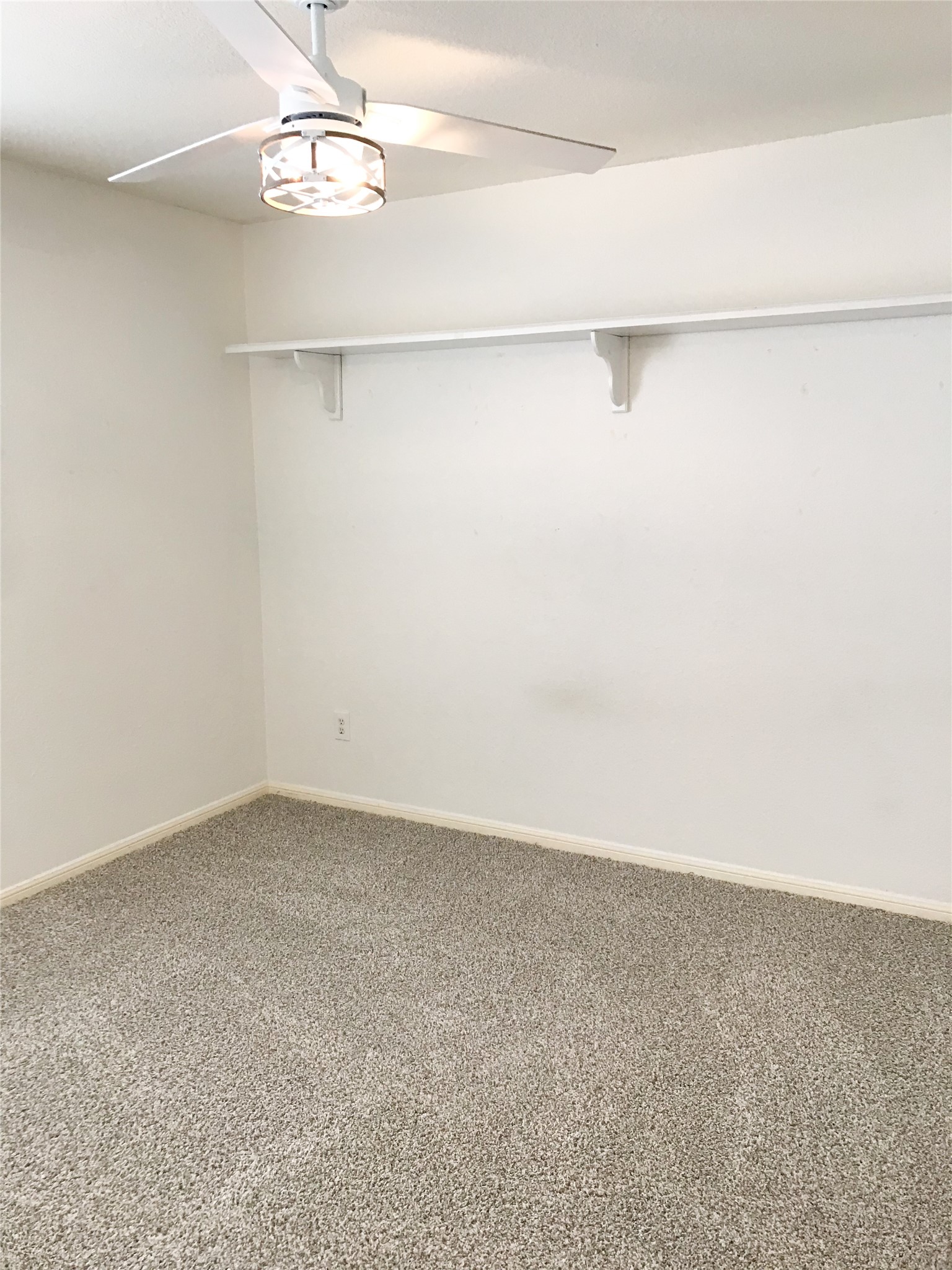 14615 Rochelle Court Cypress, TX 77429 - Photo 21 of 29 an empty room with a ceiling fan and window