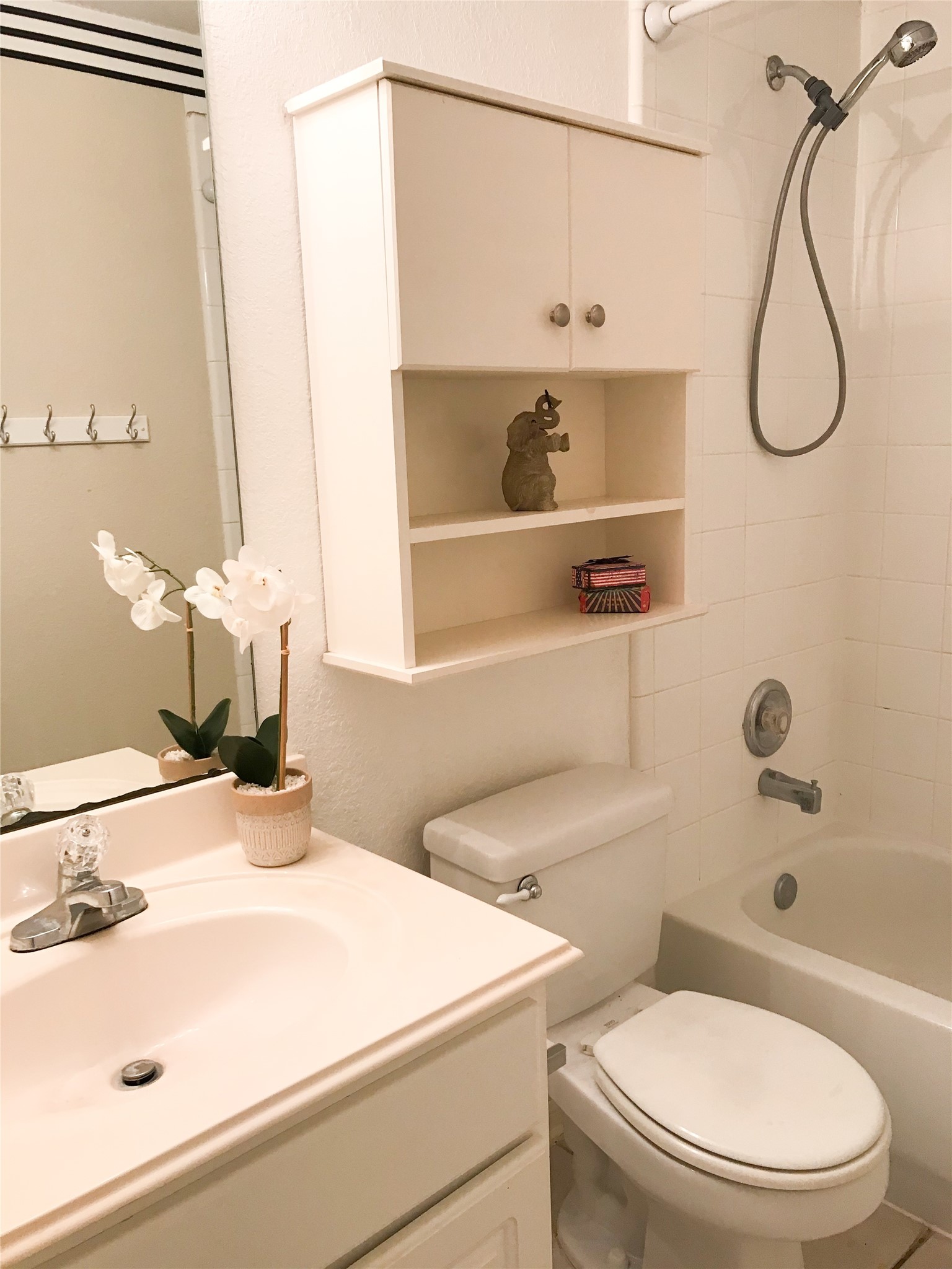 14615 Rochelle Court Cypress, TX 77429 - Photo 23 of 29 a bathroom with a sink vanity mirror and toilet