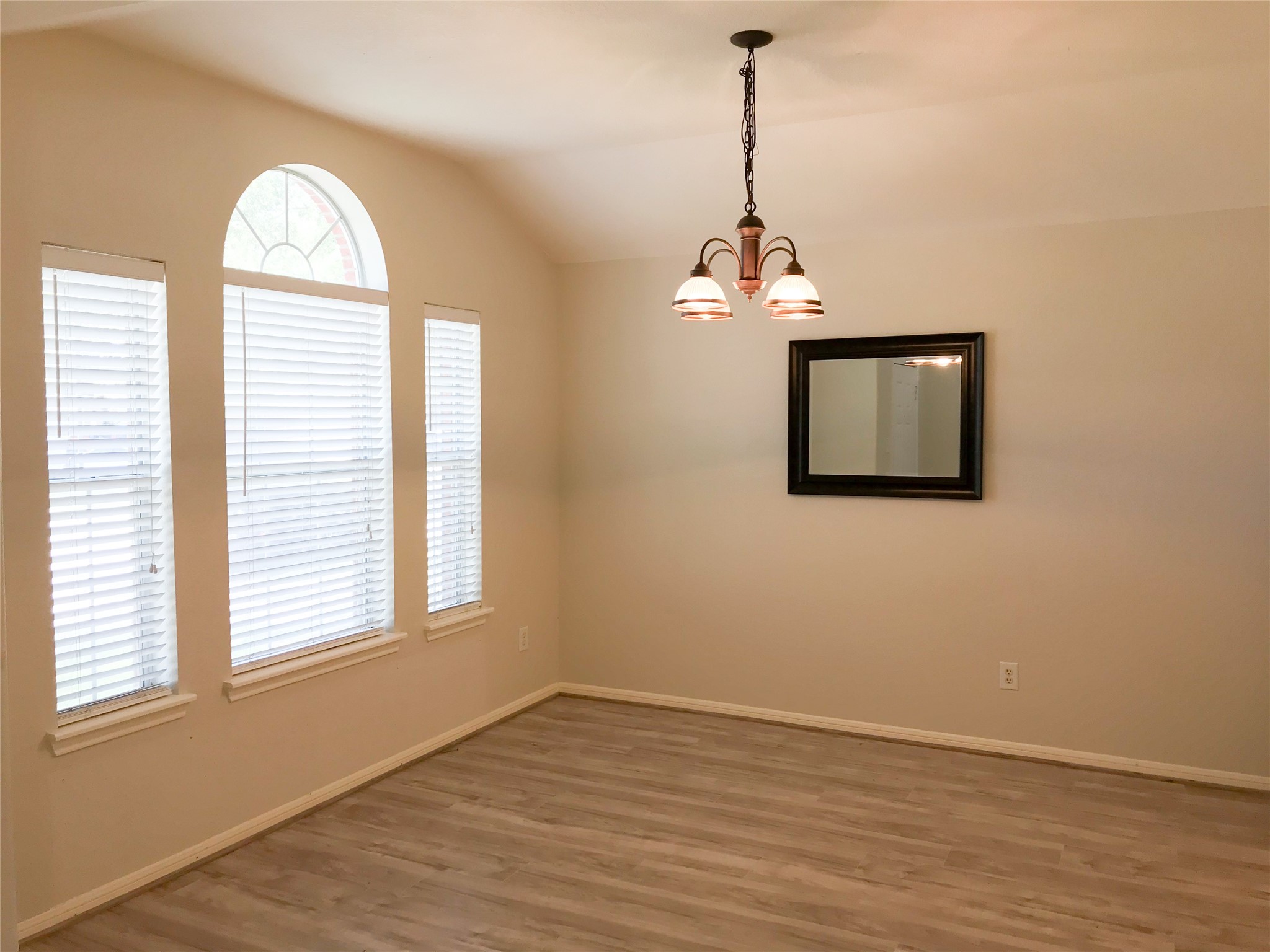 14615 Rochelle Court Cypress, TX 77429 - Photo 4 of 29 a view of a livingroom with a window and wooden floor