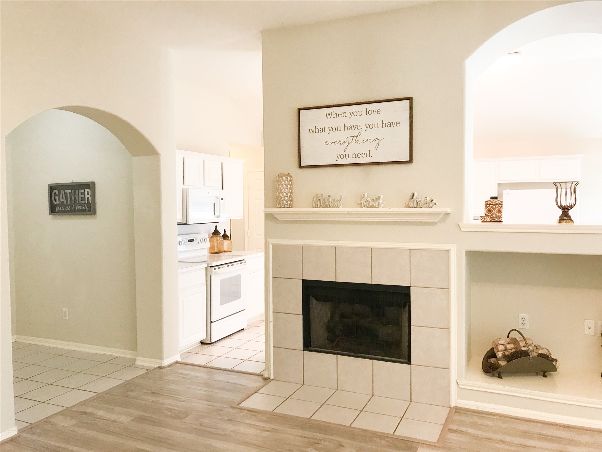 14615 Rochelle Court Cypress, TX 77429 - Photo 5 of 29 a hallway with a fireplace and cabinets
