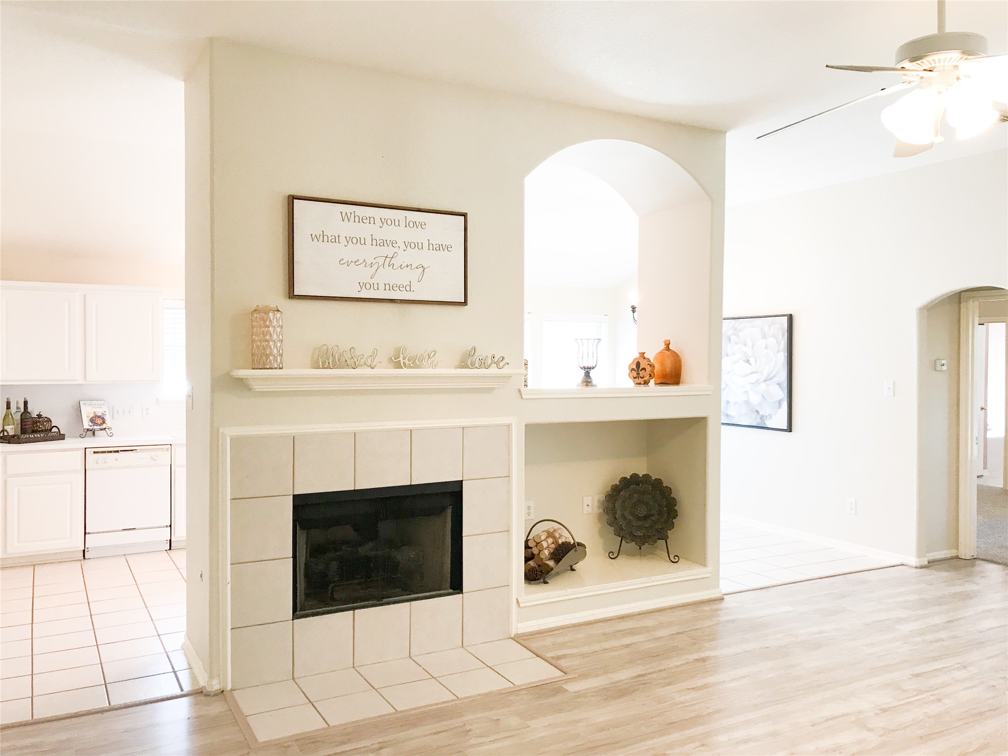14615 Rochelle Court Cypress, TX 77429 - Photo 7 of 29 a living room with a fireplace and a walk in closet with wooden floor