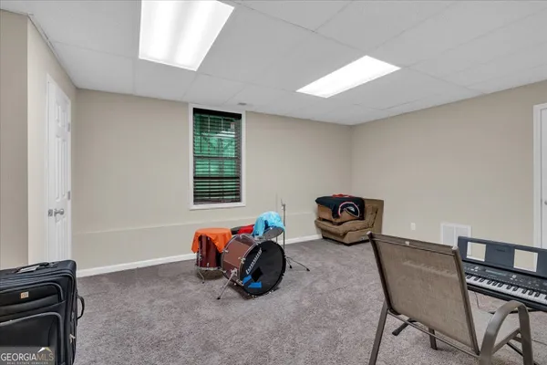 a bedroom with furniture and a window