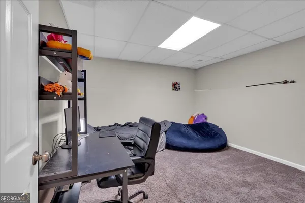 a view of a workspace with furniture