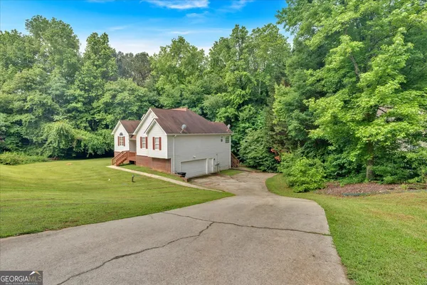 a house view with a garden space
