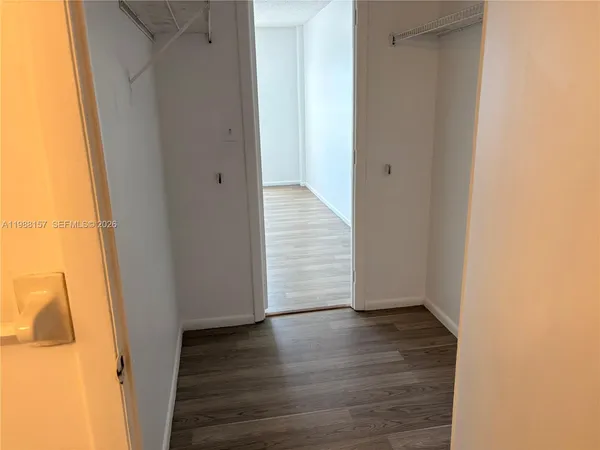 a view of a small space with wooden floor