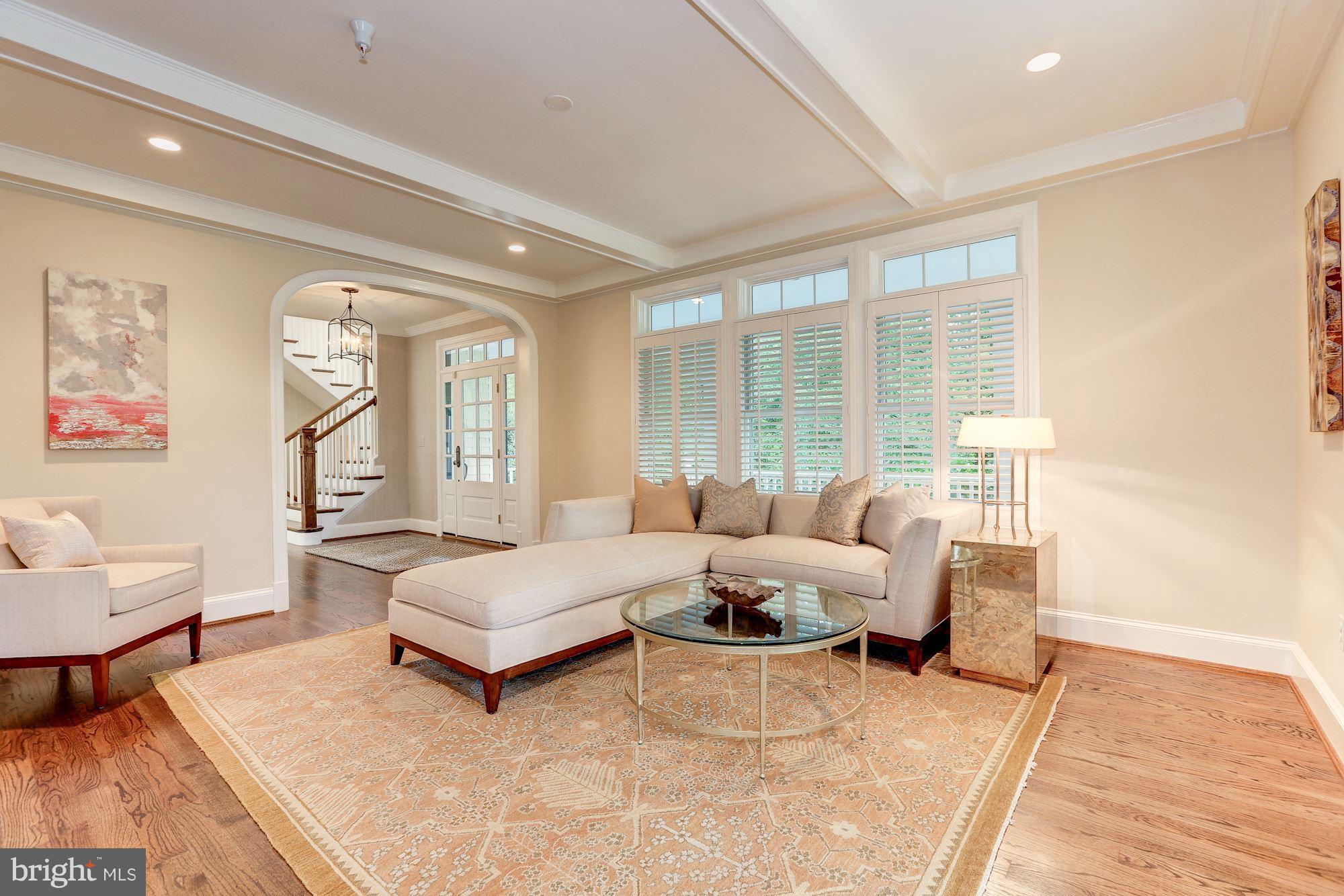 7003 Brookville Road Chevy Chase, MD 20815 - Photo 8 of 30 a living room with furniture and a large window